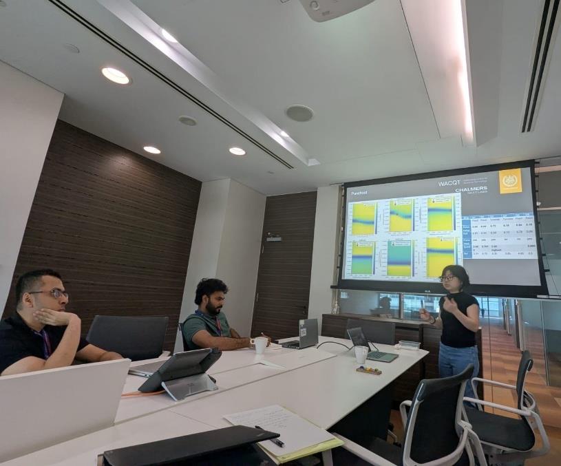 Training session in a meeting room at NQFF in Singapore, with measurement data on screen