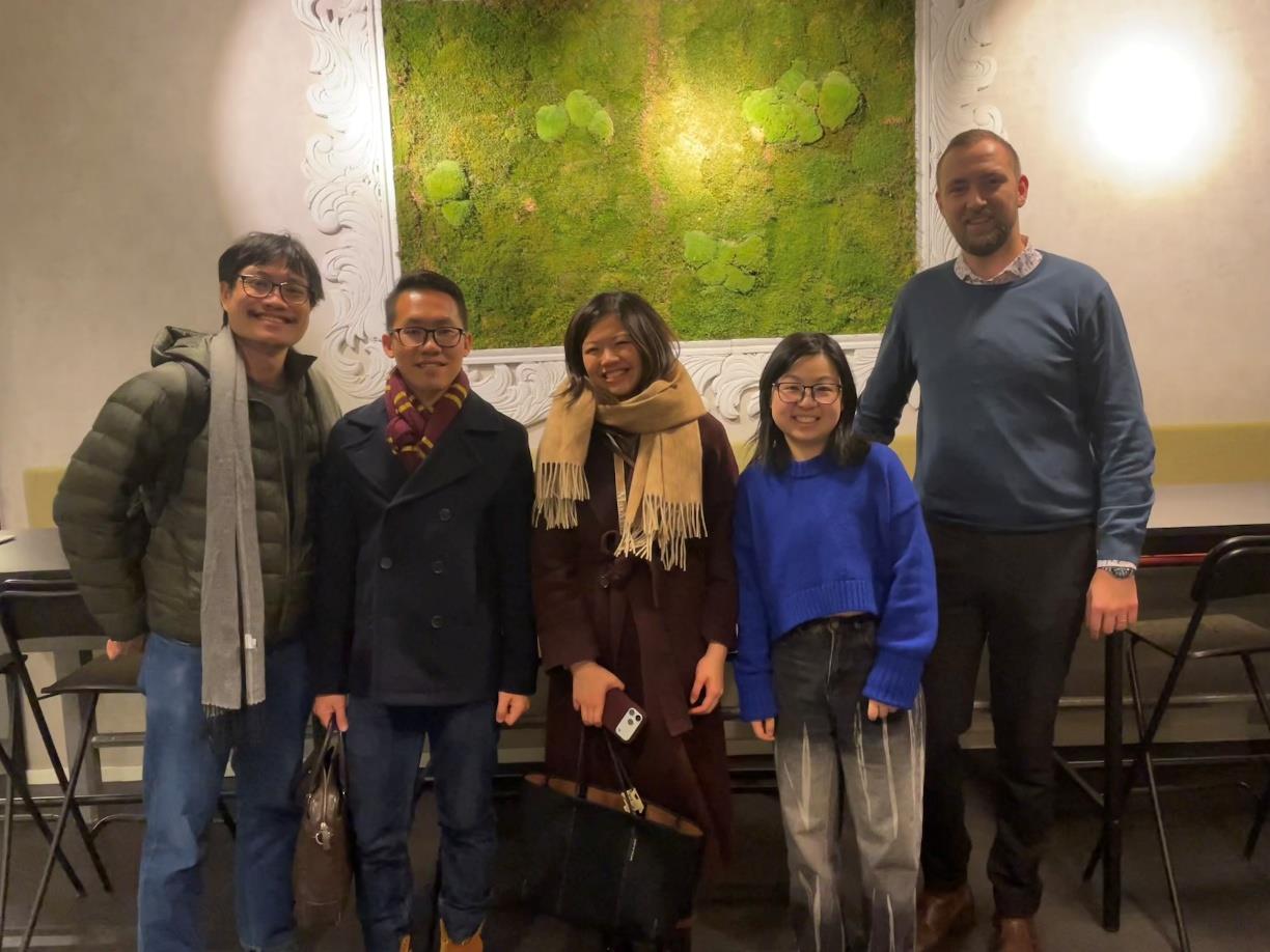 The NQFF delegation and Chalmers Next Labs representatives posing in front of a moss wall
