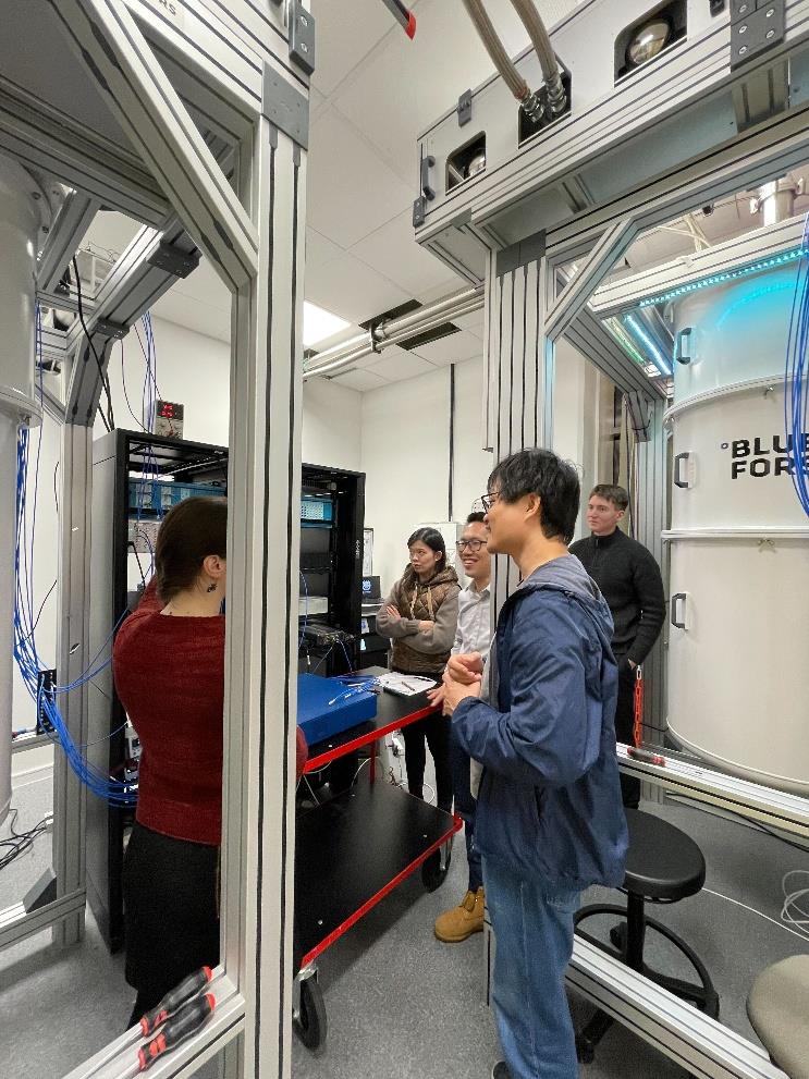 NQFF colleagues next to a dilution refrigerator in the Chalmers Next Labs testbed in Gothenburg
